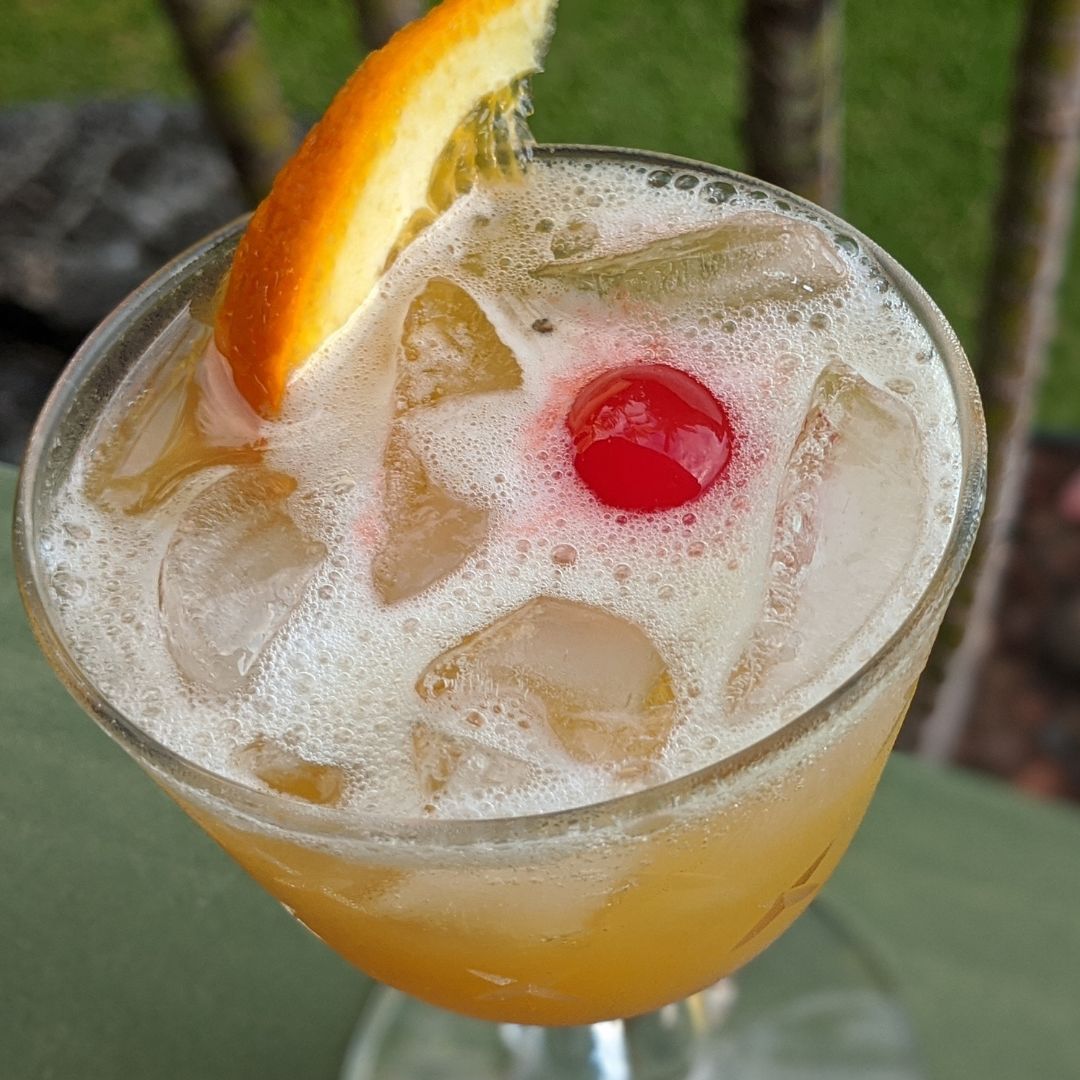 Samoa Sour Cocktail Recipe with a cherry and orange wedge garnish