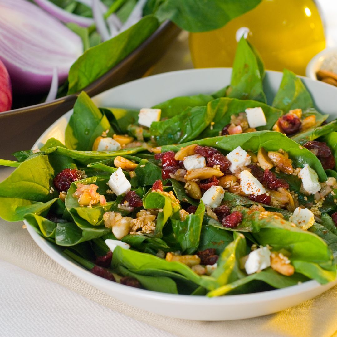 Spicy Spinach Salad with dried cranberries and goat cheese