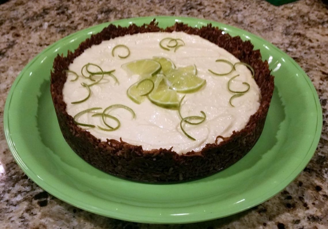 Cocoa-Nutty-Passion-Fruit-Tart Recipe on a green plate with lime garnish
