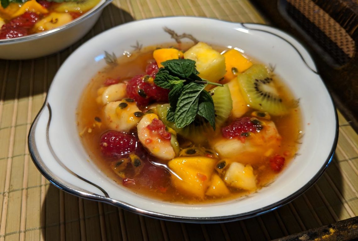 Cold Passion Fruit Soup in a bowl with mint leaves
