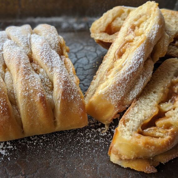 PB & J Banana Braid Recipe using Passion Fruit Jelly with powdered sugar sprinkled on top