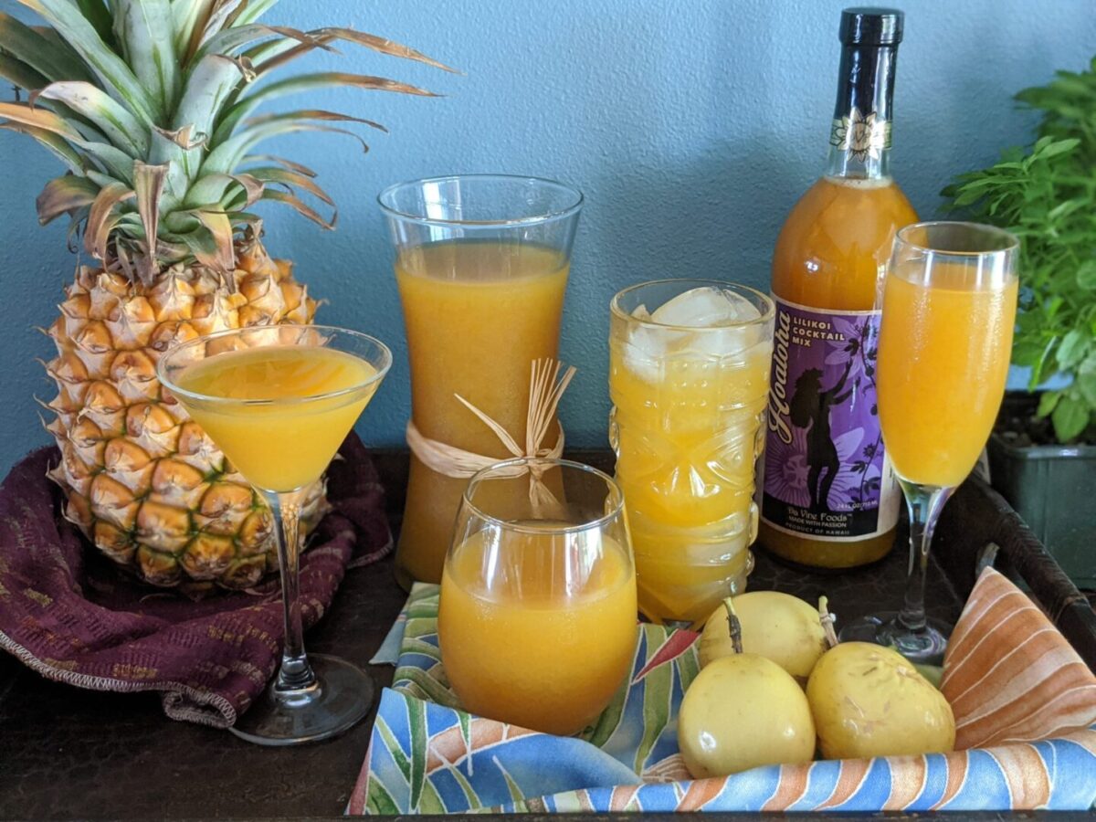 Passion Pineapple Gingerade Recipe with fresh pine apple and a passion fruit on the tray