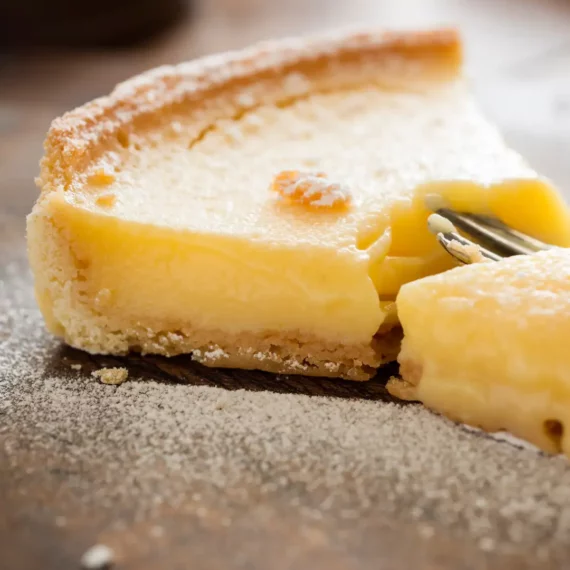 Passion Fruit Tart Slice with a fork cutting the end of it