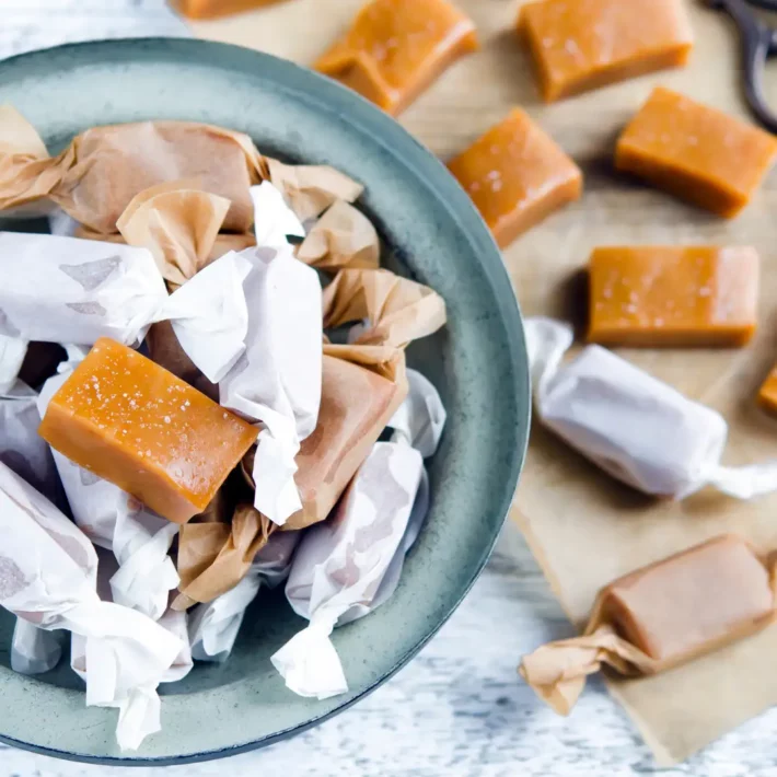 Passion Fruit Caramels in a blue bowl